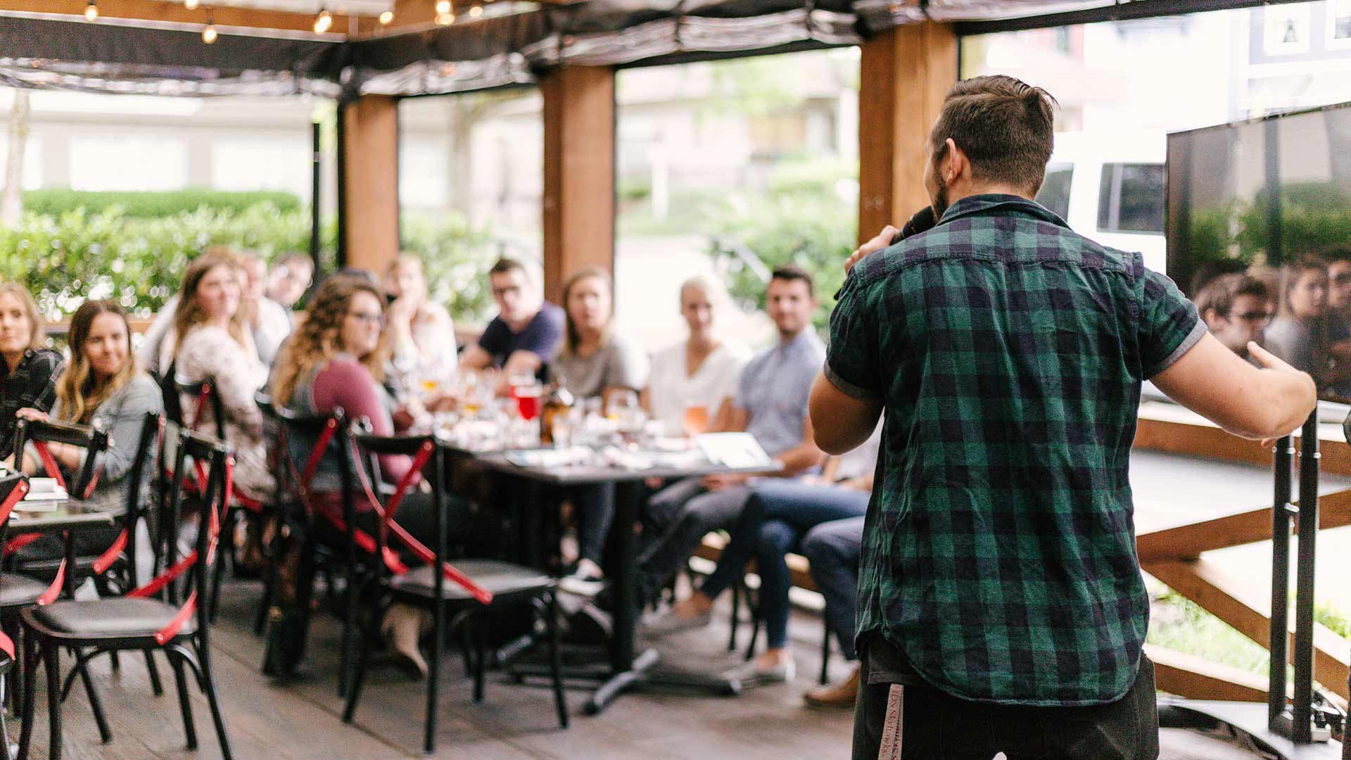 speaker talking to a group of people